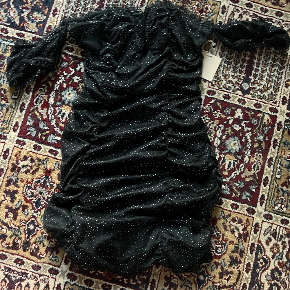 It’s a cute black sparkly dress perfect for holiday parties or dinners or dates.